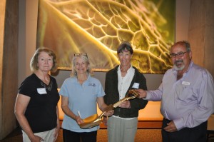 Lynn Mitzlaff, Margaret Cozine and Hollis Hassenstein of Durango Botanic Gardens accept the Golden Shovel Award from Panayoti Kelaidis
