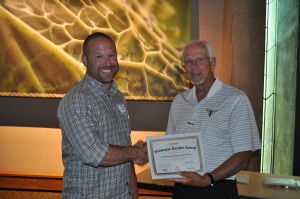 Zach Versluis accepts the Showcase Garden Award from Plant Select president, Gene Pielin for the City of Aurora Xeriscape Demonstration Garden